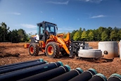 Loader in the field lifting